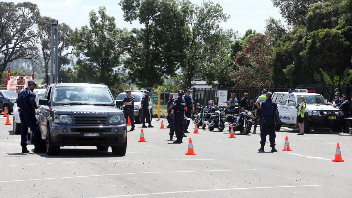 A scene from Saturday's police operation at the Fourth Reich Motorcycle Club's Albion Park headquarters. Picture: Robert Peet