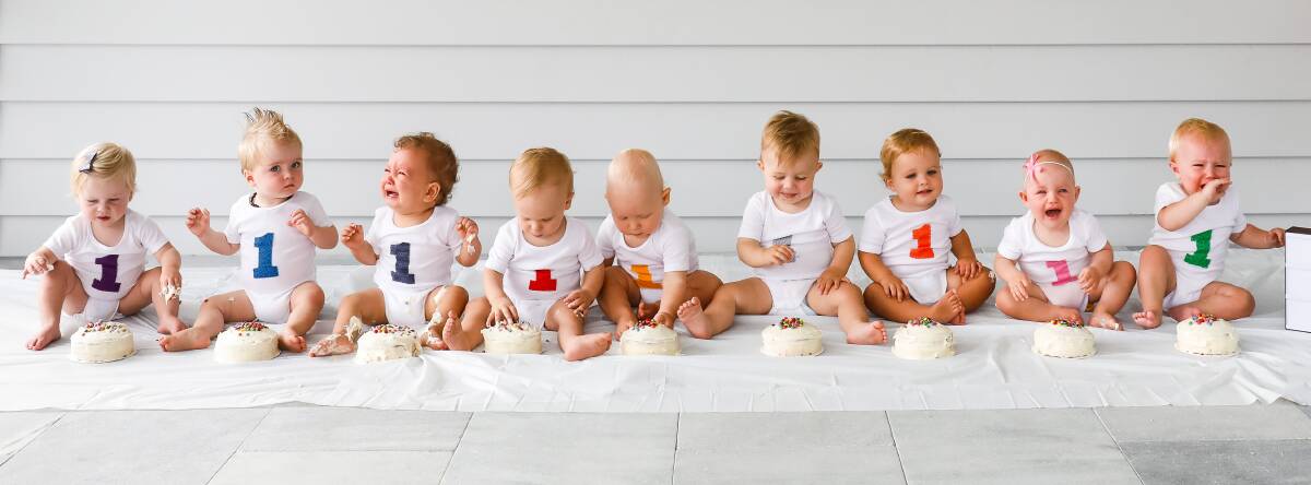 Turning one: The babies display a range of emotions at their first group shoot. Warr's daughter, Isabelle Warr-Smith, is pictured second from right. Picture: Anna Warr 