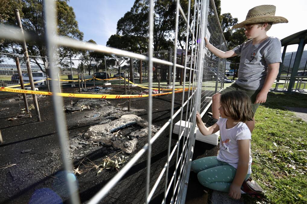 NO PLAY TODAY: Aerin and Luke Varley inspect damage to the Guest Park playground. Picture: Adam McLean 