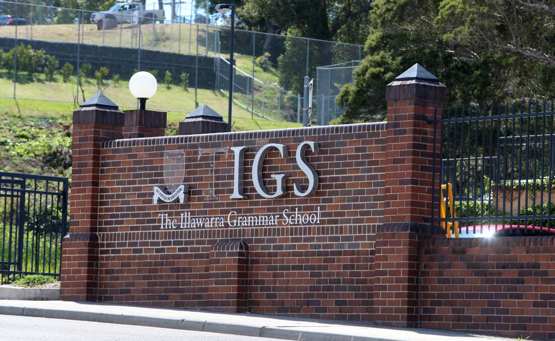 DAMAGED: A sign at the school's entry was defaced at the weekend, in what police have described as an act of vandalism unrelated to the protest activity. 