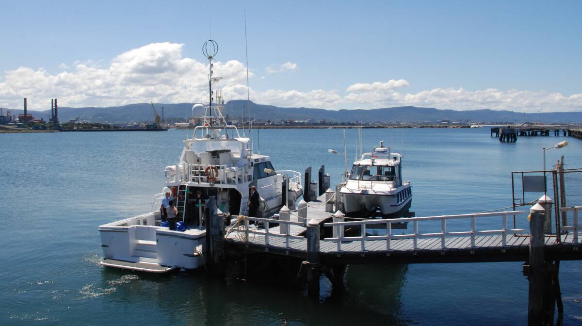 MYSTERY DEATH: A water police boat docks at Port Kembla on February 2, carrying the body of an unidentified man. Picture: Angela Thompson