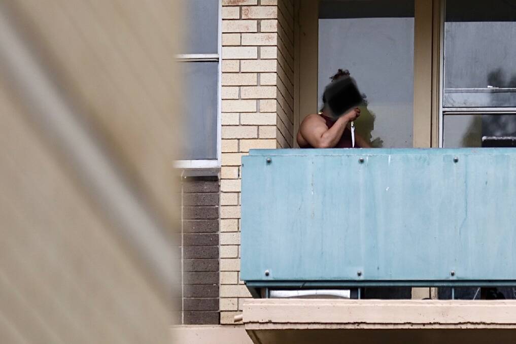 The woman was spotted holding a knife on her balcony shortly before her arrest. Picture: Adam McLean 