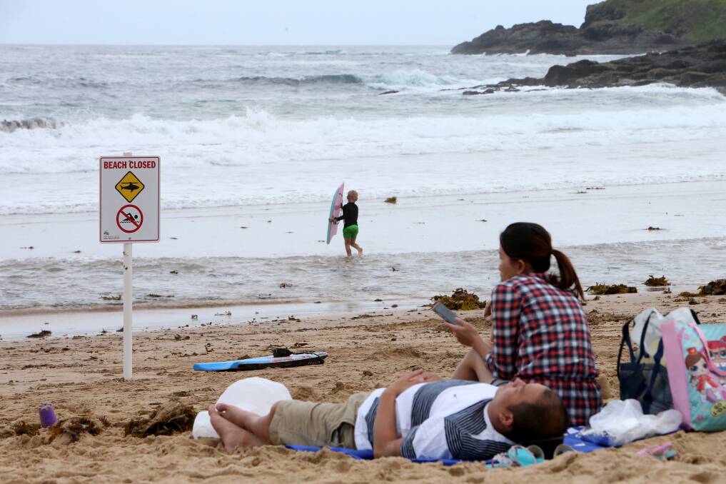 A sign declares Surf Beach closed, Monday afternoon. Picture: Sylvia Liber 