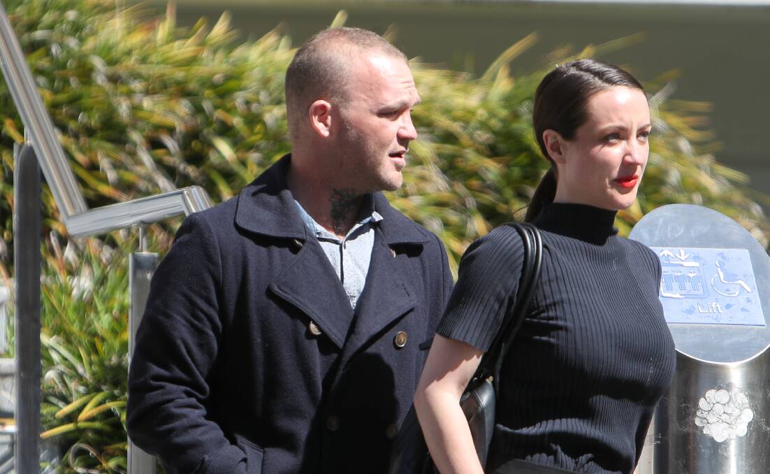 Jeremy Day, pictured with a supporter, departs Wollongong Courthouse on Monday. 