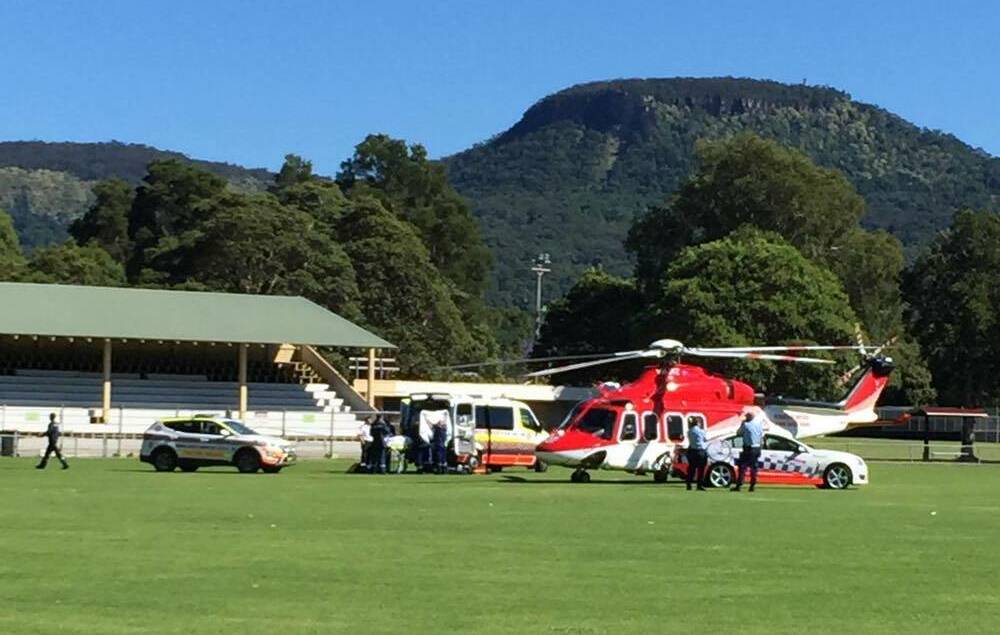 A chopper carrying the injured man prepares to depart Figtree Oval. Picture: Stephen Gooding