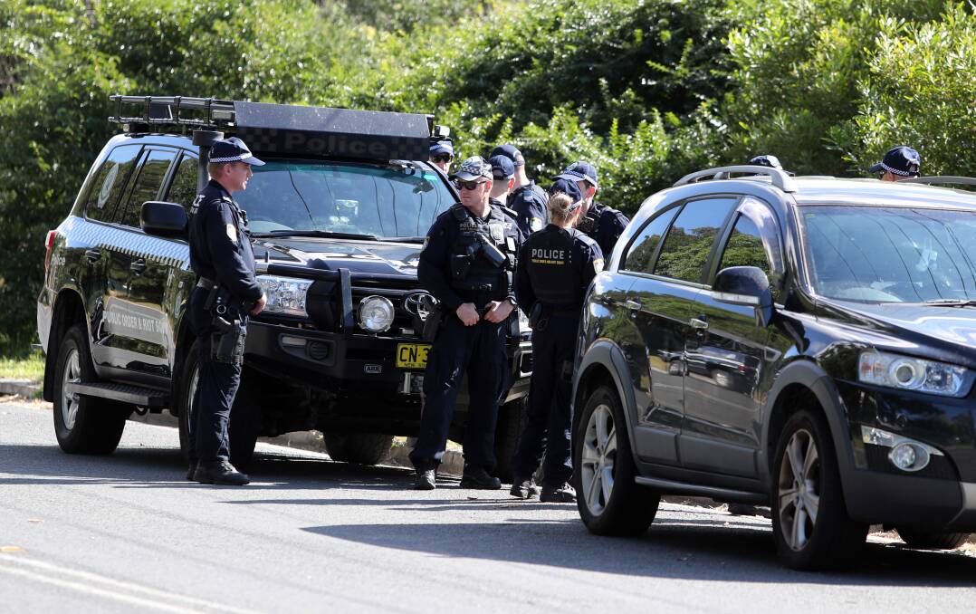 Police prepare to search the area. Picture: Robert Peet 