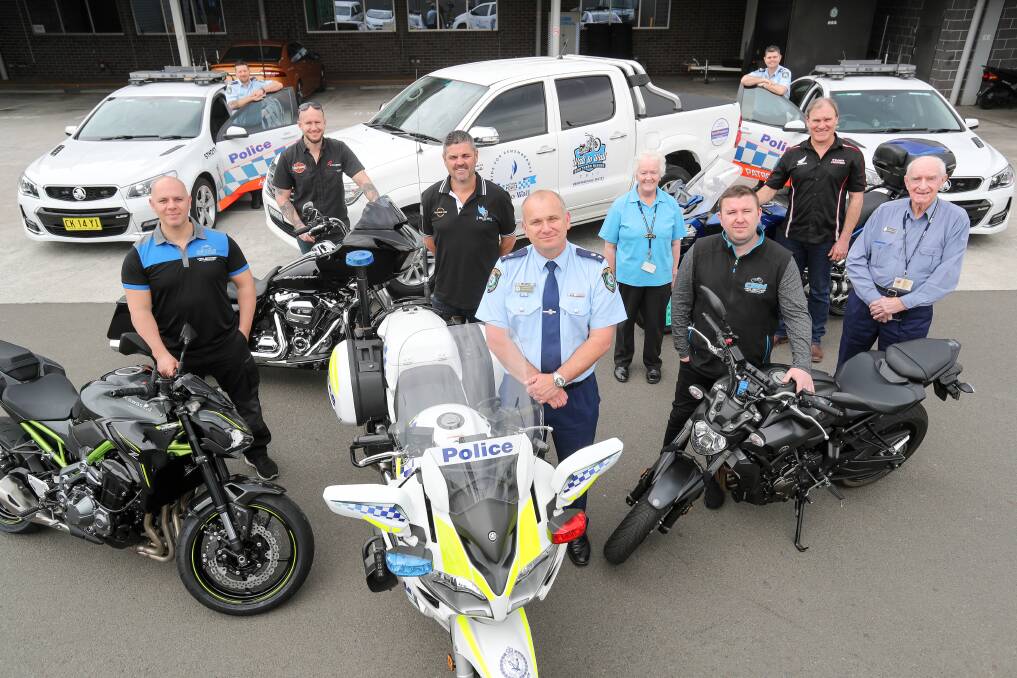 Lake Illawarra's Commander Zoran Dzevlan (centre) and Inspector Paul Allman (fourth from left) with sponsors and organisers of this year's riding contingent. Picture: Adam Mclean