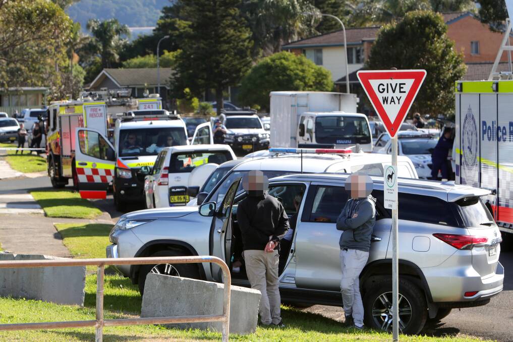 The street was crowded with emergency services vehicles as the siege continued. Picture: Sylvia Liber 