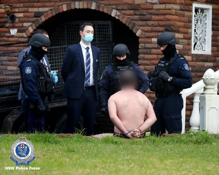 A man is arrested during Wednesday's raids. Picture: NSW Police