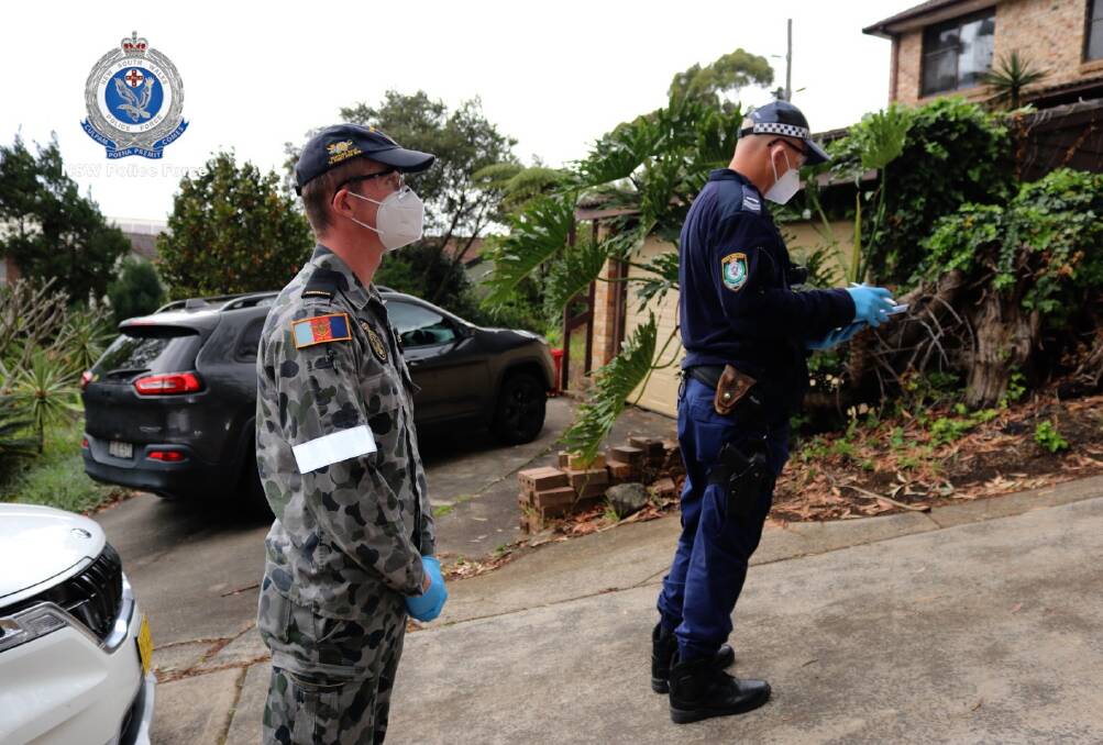 Pictures show a police office and an ADF officer attending addresses in the Wollongong and Lake Illawarra police districts. Picture: supplied 