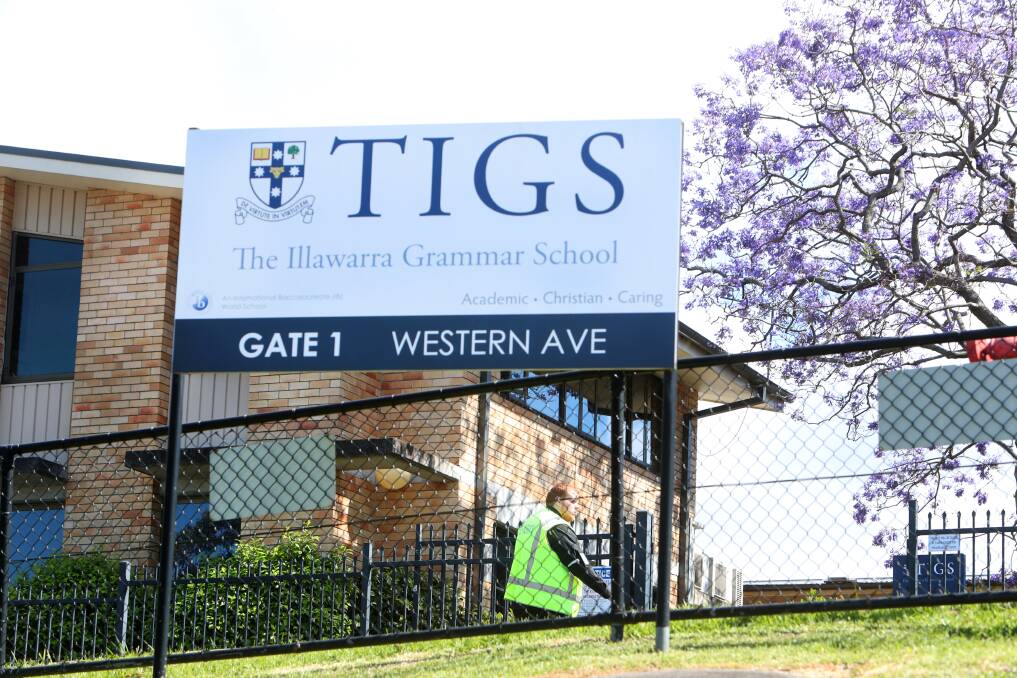 A security guard patrols the grounds of TIGS on Monday morning as a planned protest - cancelled at the eleventh hour - fails to eventuate. Picture: Sylvia Liber 