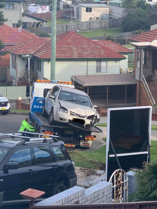 The damaged Commodore is loaded onto a tow truck. Picture: supplied