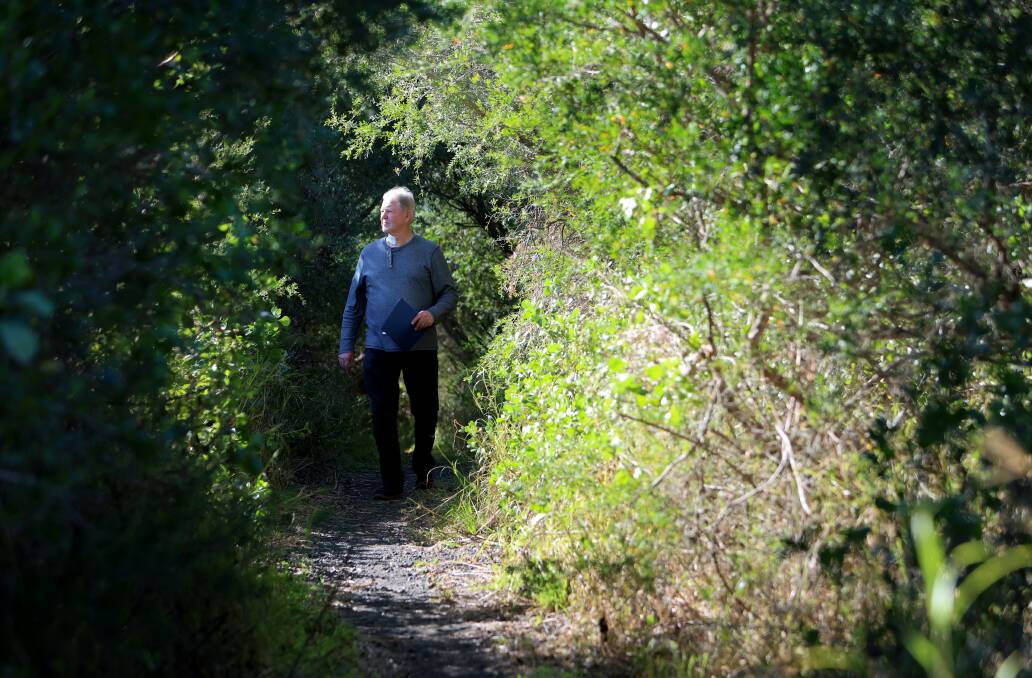 Jeff Dakers walks along a path in the sand dunes at Windang on August 10, 2023. Picture: Sylvia Liber 