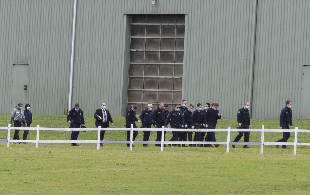 A large number of police, including officers from anti-gangs squad Raptor, attended the Helensburgh raid. Picture: Robert Peet 