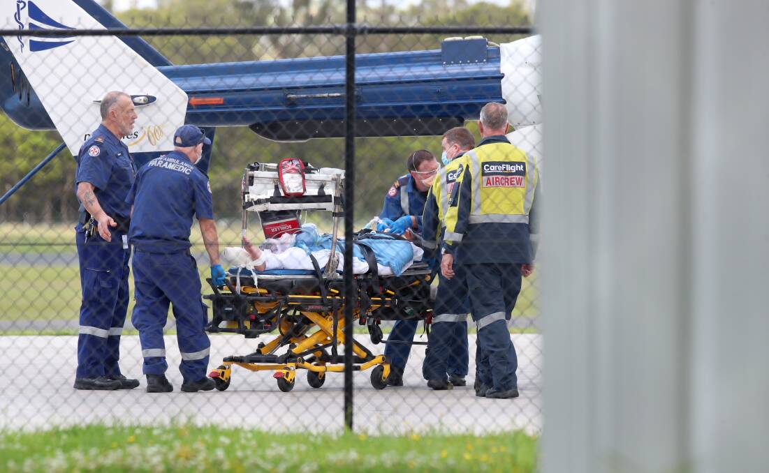 The man is sedated before take-off at Shellharbour Airport. Picture: Sylvia Liber 