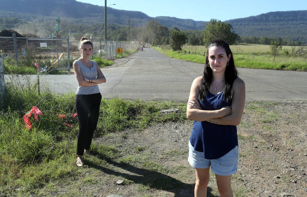 Ami Beck (right, with fellow protester Britt Bryant), pictured at the proposed jail site in April. Only the roadway would have separated her new home from the development. Picture: Robert Peet