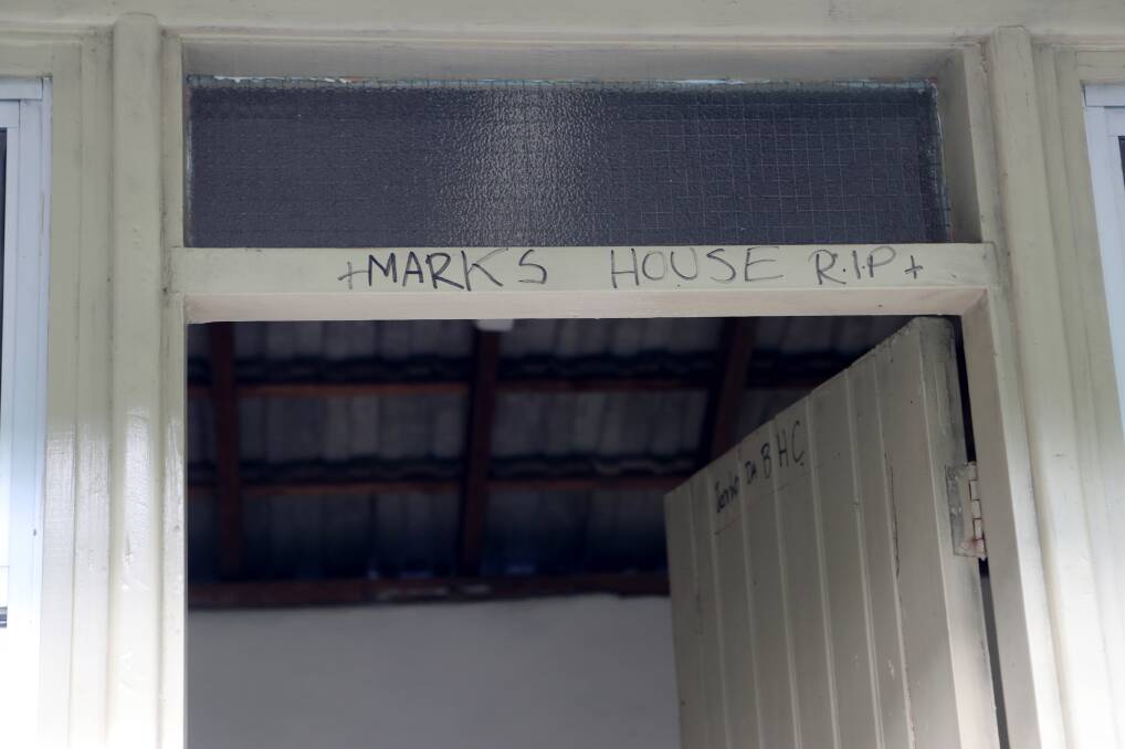 REST IN PEACE: A scrawled message honours Mark Dower at the entryway to the laundry where his remains were found. Picture: Sylvia Liber 