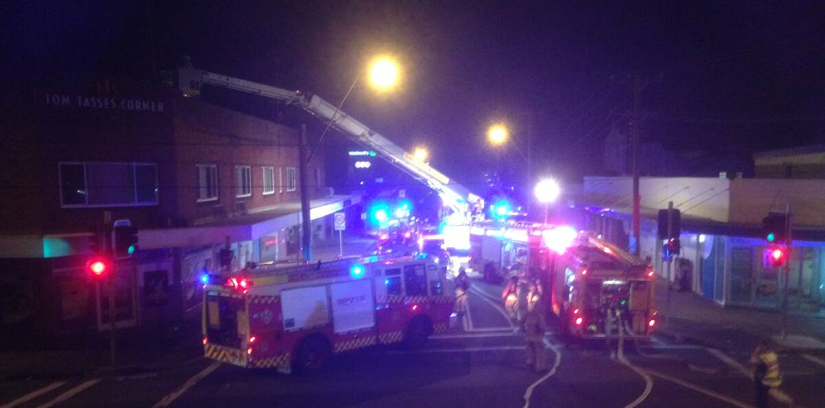 THREAT: Fire trucks converge on a unit block on Daisy Street, late Wednesday night. Picture: Bob Young