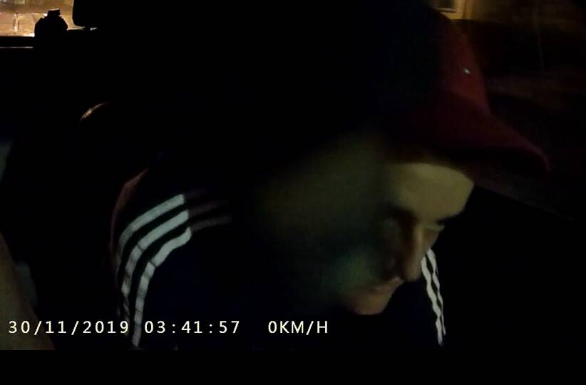Mitchell's face flashes briefly in front of the camera, in a still captured from in-car recordings played in court. 