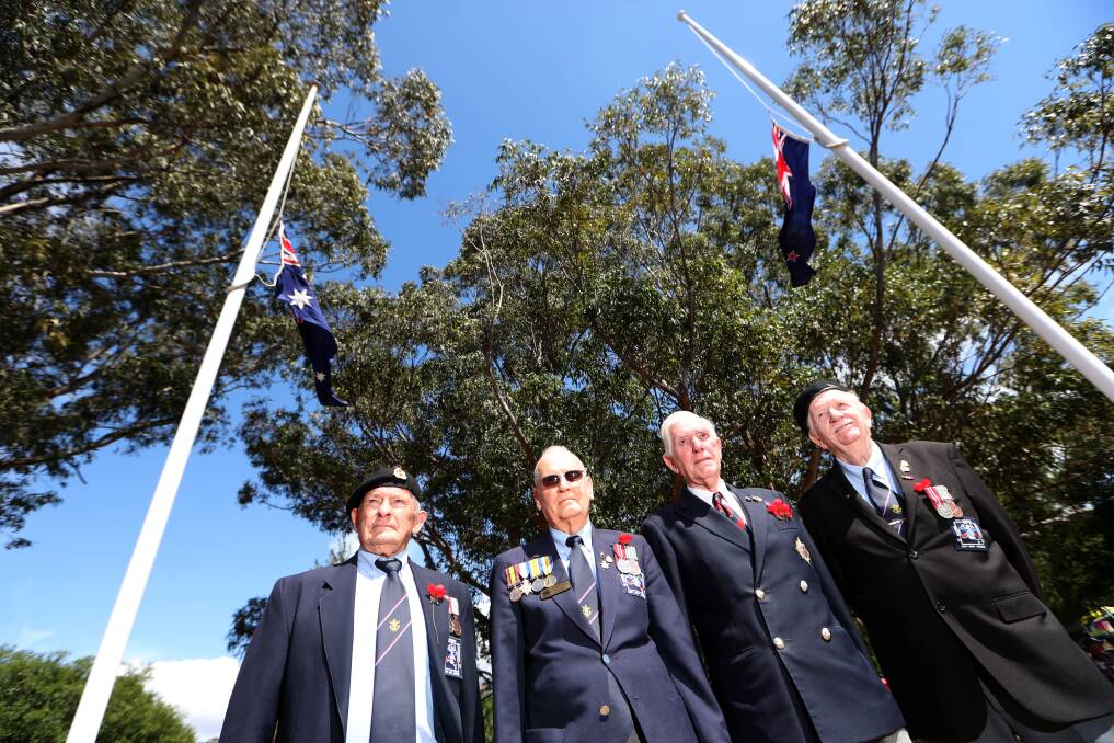 IN SERVICE: Veterans John Day, Brian King, Peter Edwards and Roger Carr stand for Remembrance Day in Wollongong. 