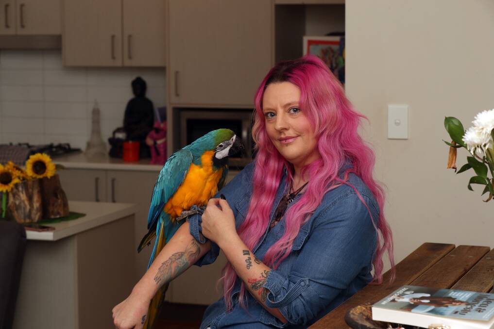 Ms Cahill said she took comfort from her animals, including her bird Oli, during her "stressful" court case. Picture: Robert Peet 