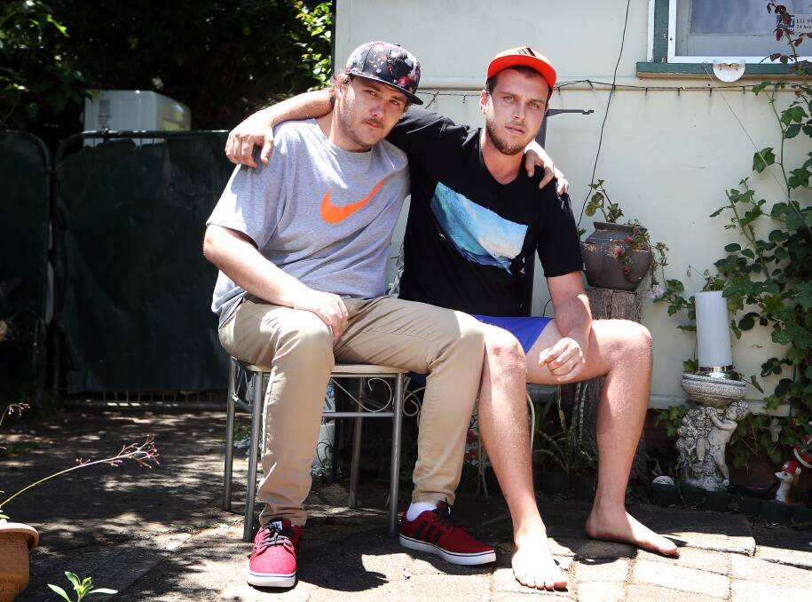 CLOSE AS SHADOWS: Dwayne McWatters, with friend Daniel Allen, is calling on anyone with information about his brother's death to contact police. Picture: Sylvia Liber