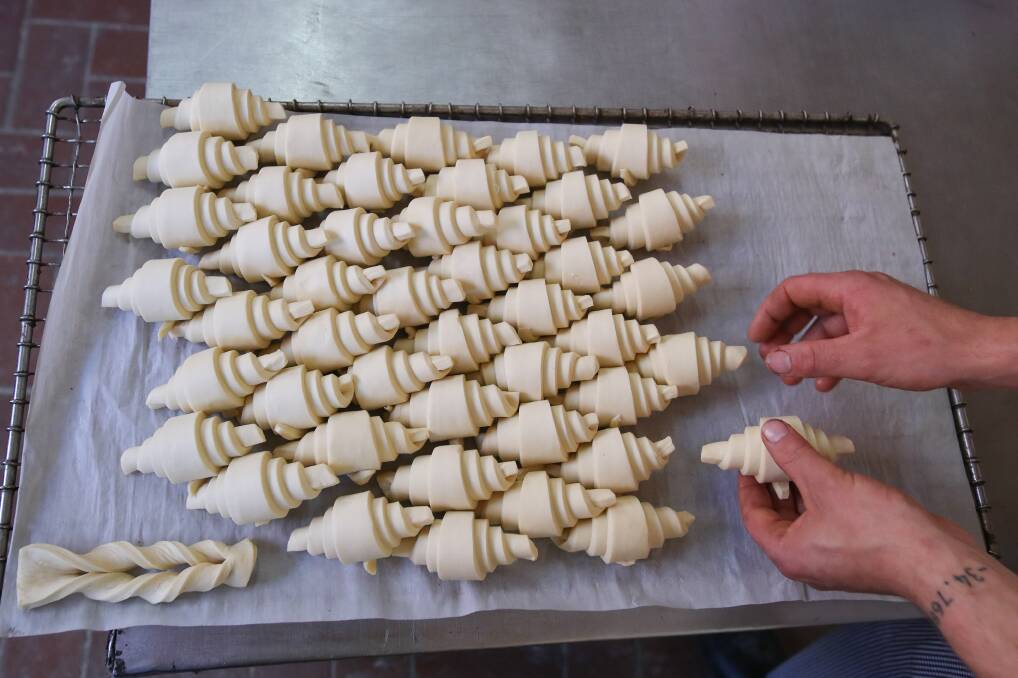 A batch of croissants takes form in the kitchen at Parfait Patisserie. 