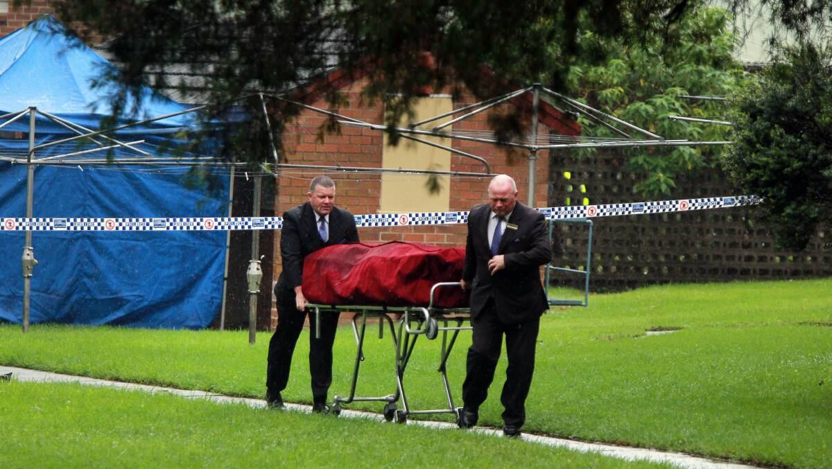 Mr Dowers remains are removed from the Crana Place complex. Picture: Sylvia Liber 