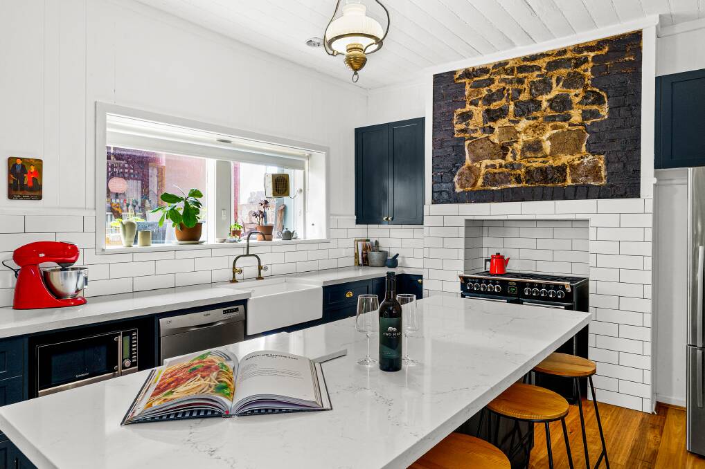 The home marries a modern "chef's kitchen" with features original to the 1860s design. 