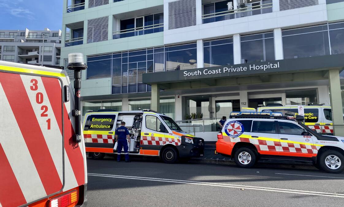 A paramedic departs Burelli Street's South Coast Private Hospital on Wednesday morning. 