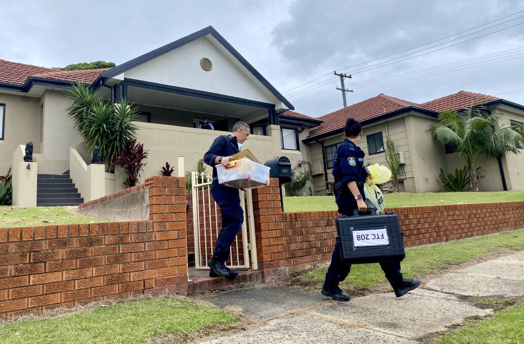 Forensic officers depart the property Tuesday morning. Picture: Angela Thompson
