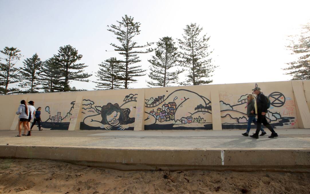 The sprawling artwork, pictured on Saturday, covers a large stretch of Thirroul promenade. Picture: Sylvia Liber 
