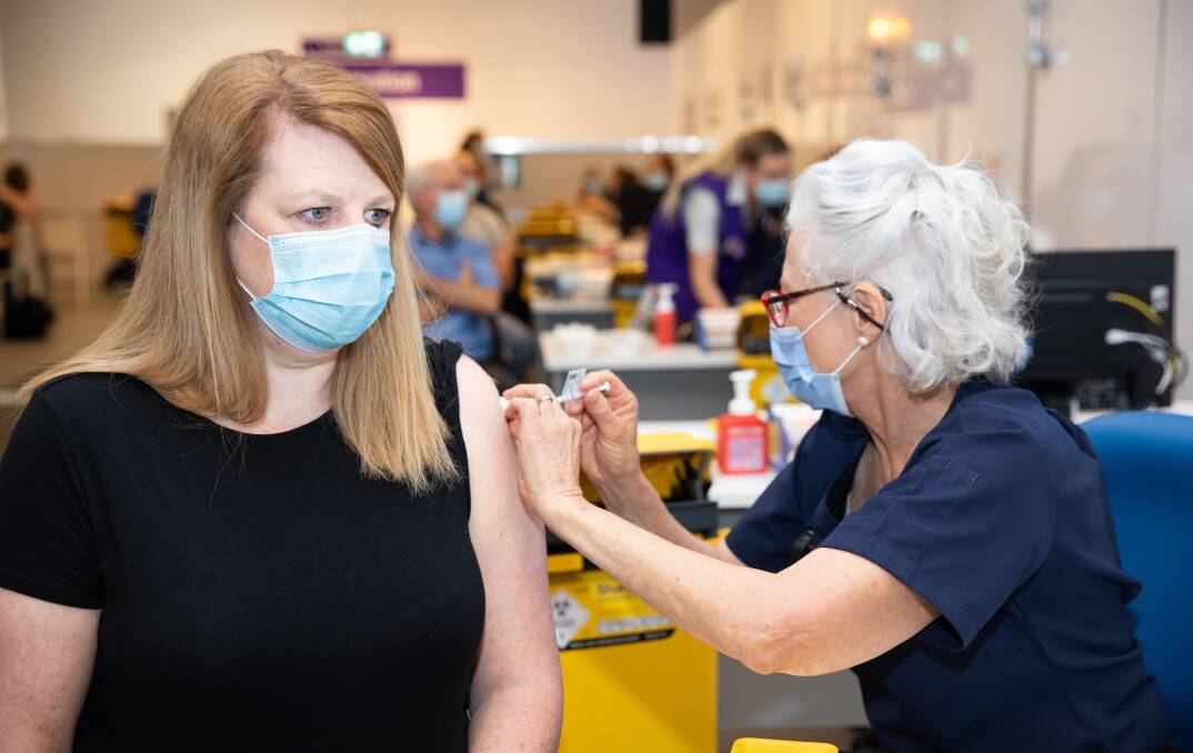 "It was exceptionally efficient and well-organised" says Helen Curtis, pictured receiving a vaccination at the hub on Monday. Picture: supplied 