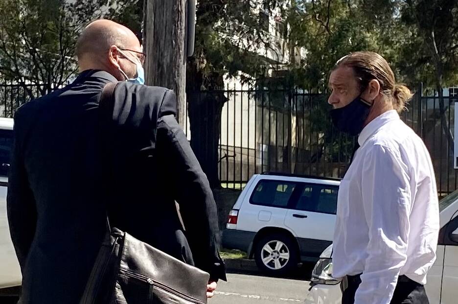 Dismissed: Phillip Dennison (right) with his lawyer Patrick Schmidt outside court yesterday.