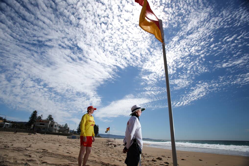 Woonona SLS volunteer Stacey Paddon and Holly Lane - Wollongong city's first full-time female lifeguard - look to the sea at Thursday's launch event, marking the start of the 2018/2019 swim season. Picture: Adam McLean 