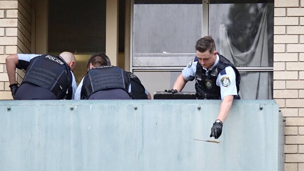 A police officer drops the bone-handled knife the the ground as Jerome is arrested. Picture: Adam McLean 