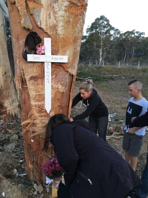 TRIBUTE: Relatives of Jose Ribeiro mark the tree where he died on Tuesday, after the truck he was driving careered off the road. Picture: supplied
