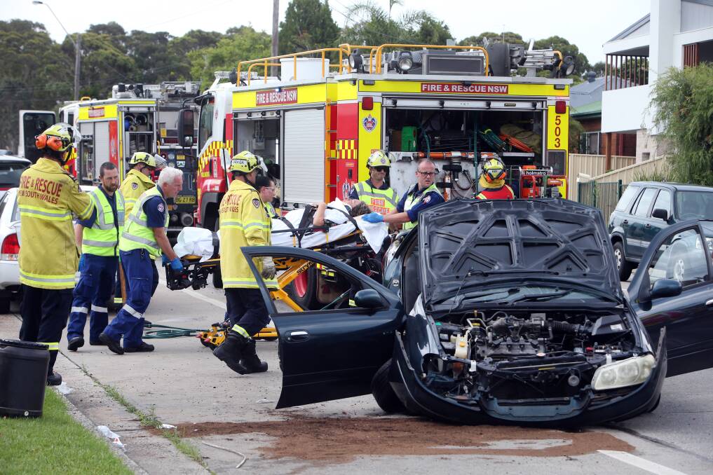UNBELIEVABLE: Emergency services converge on the damaged car at the centre of Tuesday's crash. Picture: Sylvia Liber