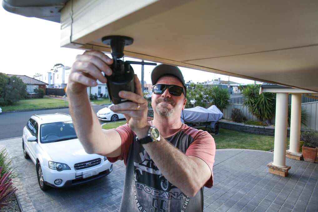 ON EDGE: Shane Ralph installed security cameras at his home on Monday, after his son's car was targeted by vandals. Picture: Adam Mclean 