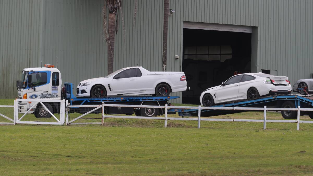 Police seized three vehicles from the property, including a Holden Maloo ute and a white BMW-486. 