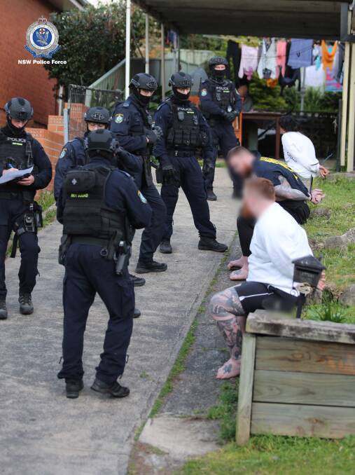 The Westman twins are arrested at their Coniston home in a scene from the August 2019 drug raids. Picture: NSW Police 