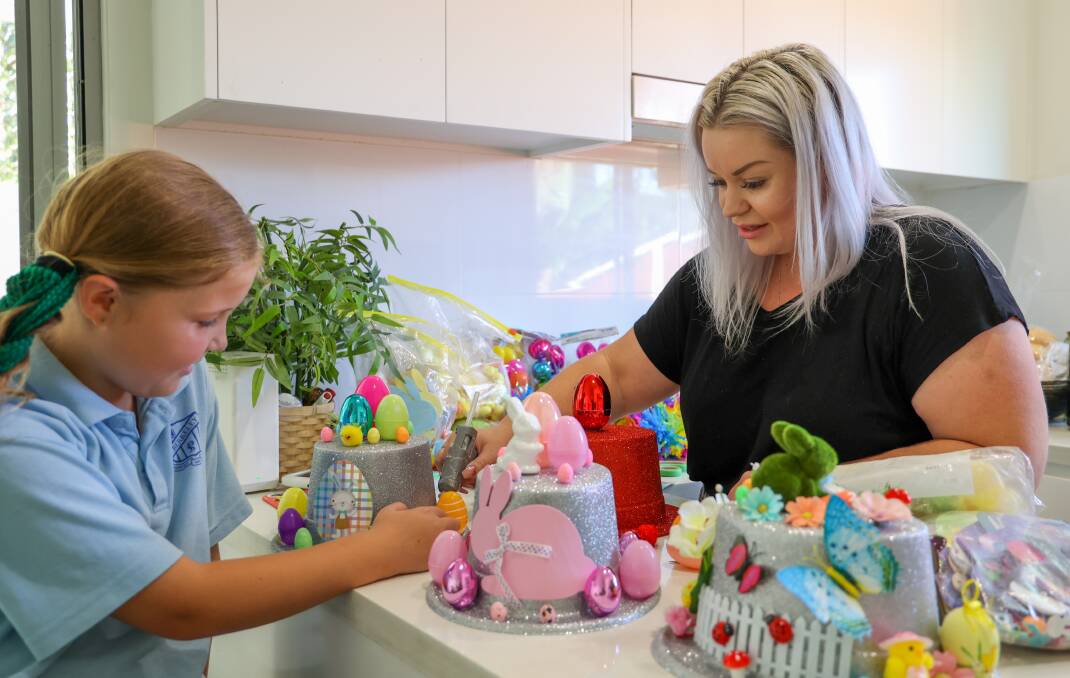 Amy Vudmaska, with daughter Azahli, has made a side business selling ready-to-wear Easter parade hats to time-poor Illawarar parents. Picture: Wesley Longergan