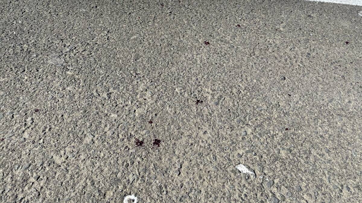 Blood stains at the boat ramp car park show where the injured man is believed to have been. 