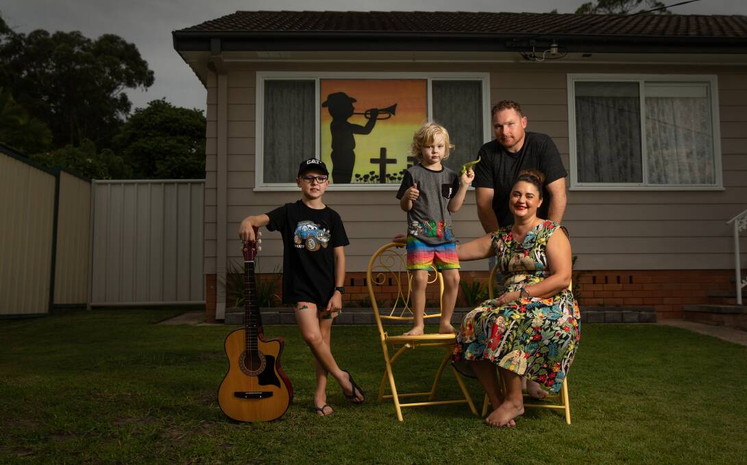 Unique situation: Hunter, Theodore, Damien and Jenn Clark, who said their family was using art to cope while staying home. Picture: Marina Neil