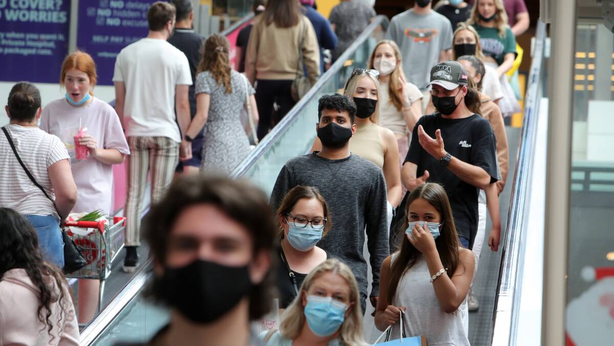 Shoppers masked up at the Boxing Day sales at Stockland Shellharbour . Picture: Sylvia Liber. 