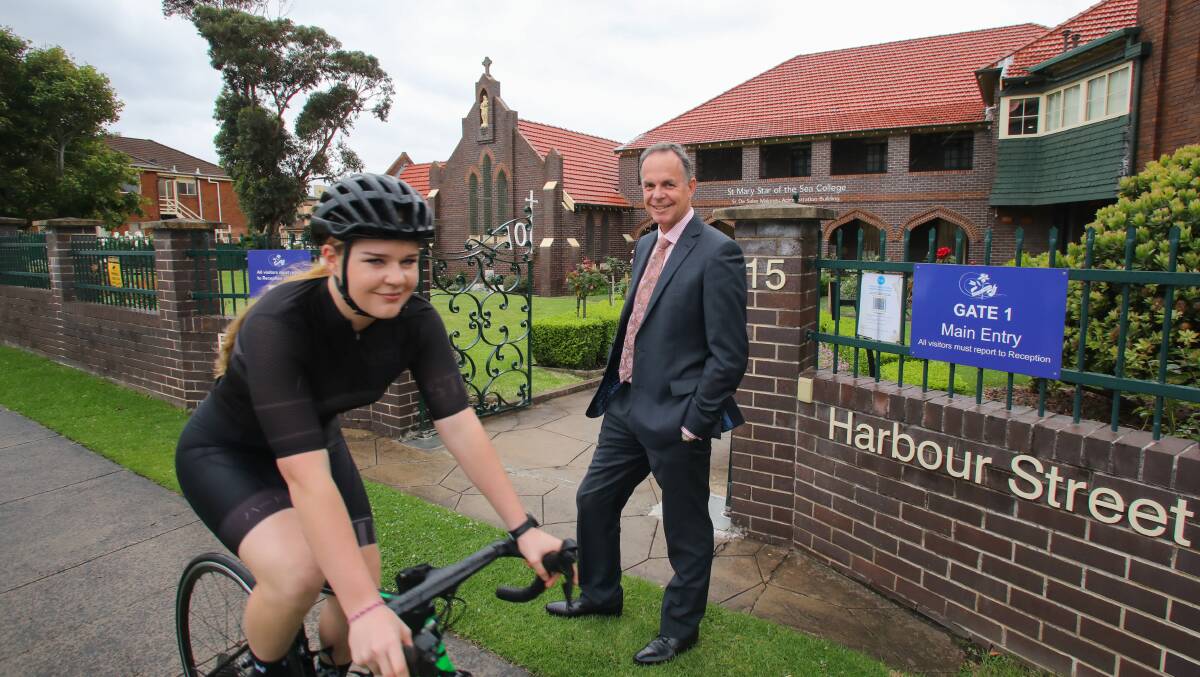 St Mary Star of the Sea College student and cyclist Poppy Pollock with principal Tony Fitzgerald. Picture Wesley Lonergan
