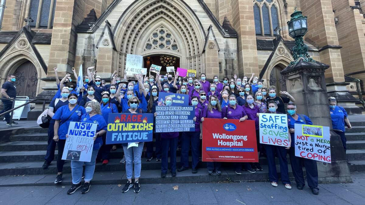 BIG TURNOUT: Around 5000 nurses and midwives dressed in scrubs and face masks marched on NSW parliament, including Wollongong union members. Picture: Genevieve Stone