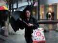 A shopper braces the deluge in Wollongong CBD. Picture: Sylvia Liber