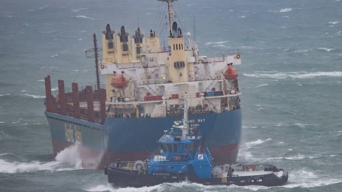 Tugs towing the Portland Bay. Picture: Mark Sundin