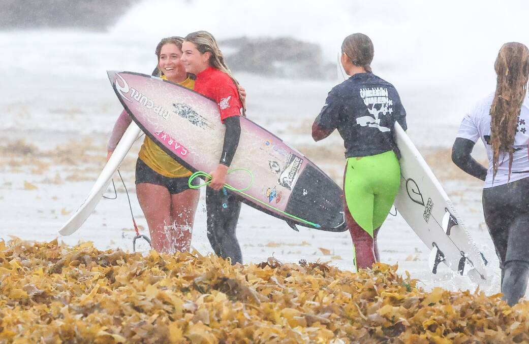 Conditions were not perfect at Woonona Beach but it didn't wipe the smile from competitors' faces. Picture by Adam McLean